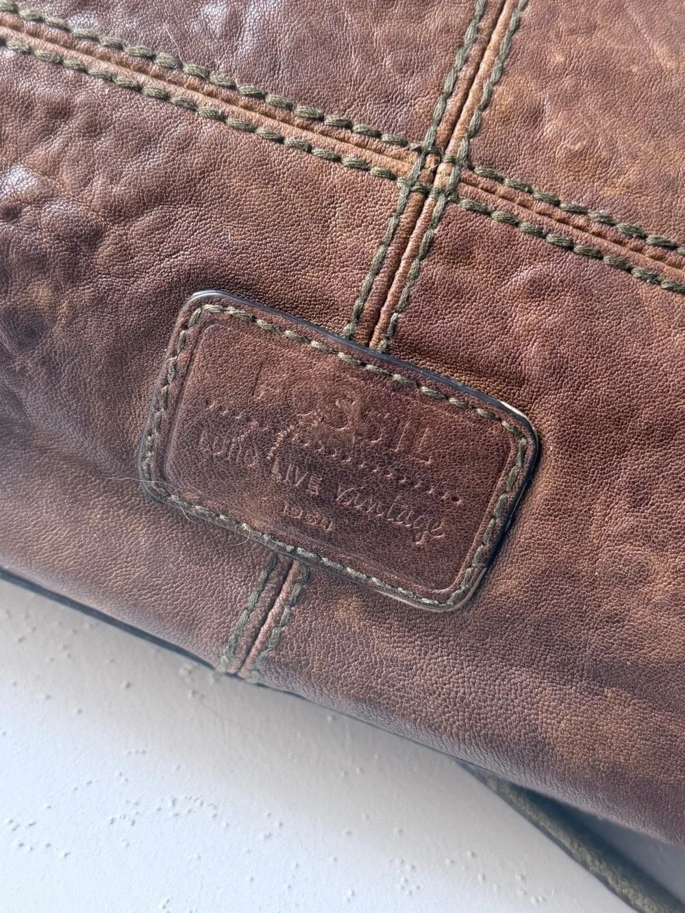 Hyper Distressed Fossil Vintage Bag.
